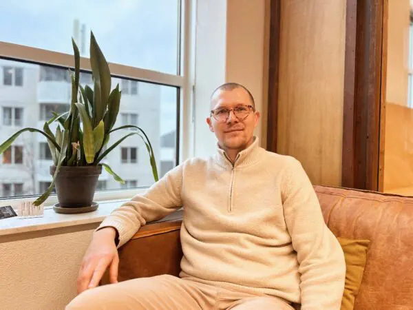 Coworker Piotr Drozd on a couch in the Hub café