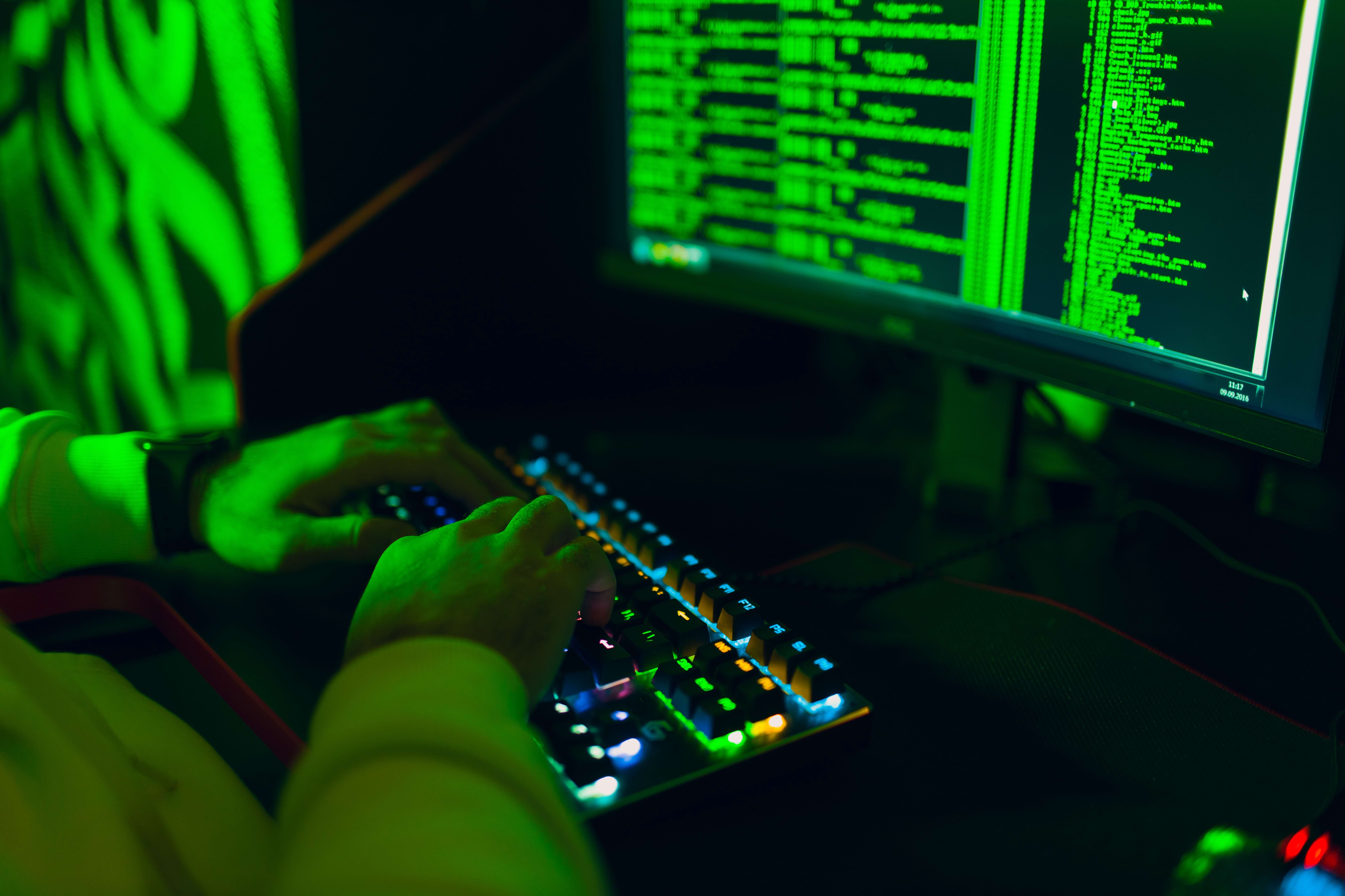 hacker-in-hoodie-working-hacks-code-site-on-person-2024-11-27-13-24-19-utc (1)